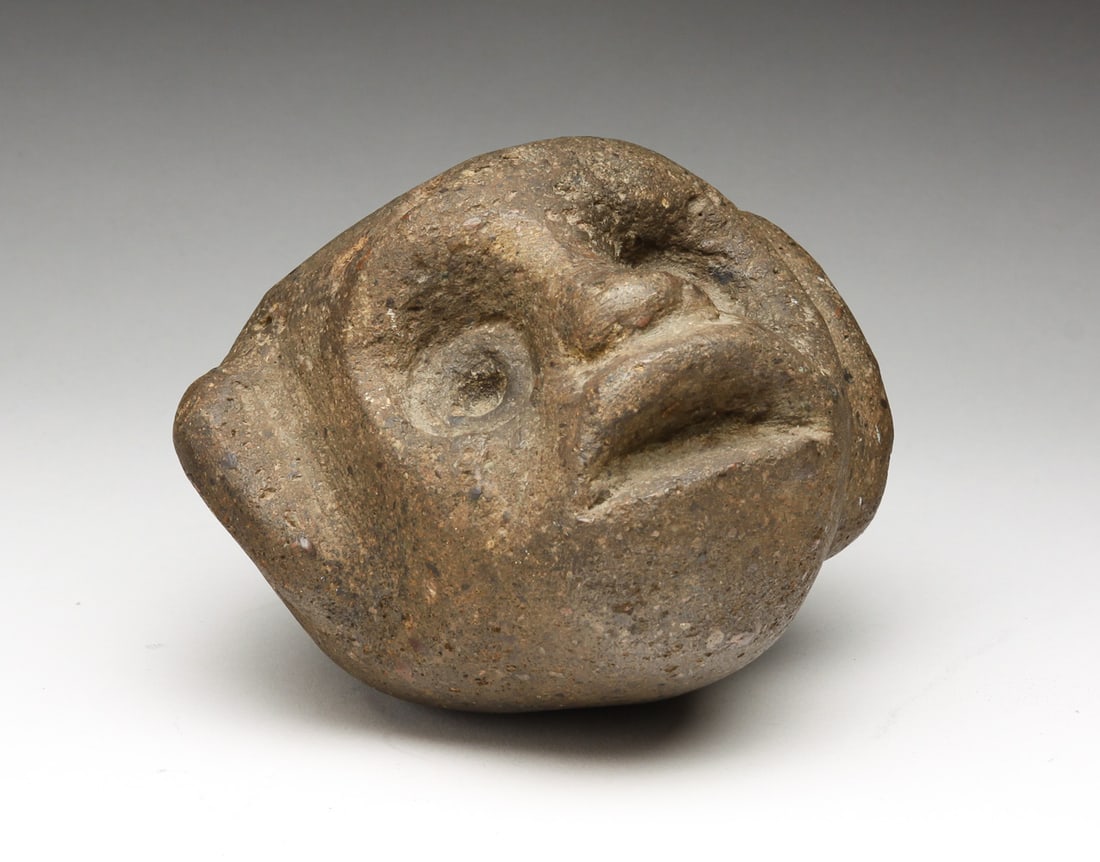 CARVED STONE MONKEY HEAD.: American or European, late 19th-early 20th Century. Face carved from slightly porous stone. 4"h.