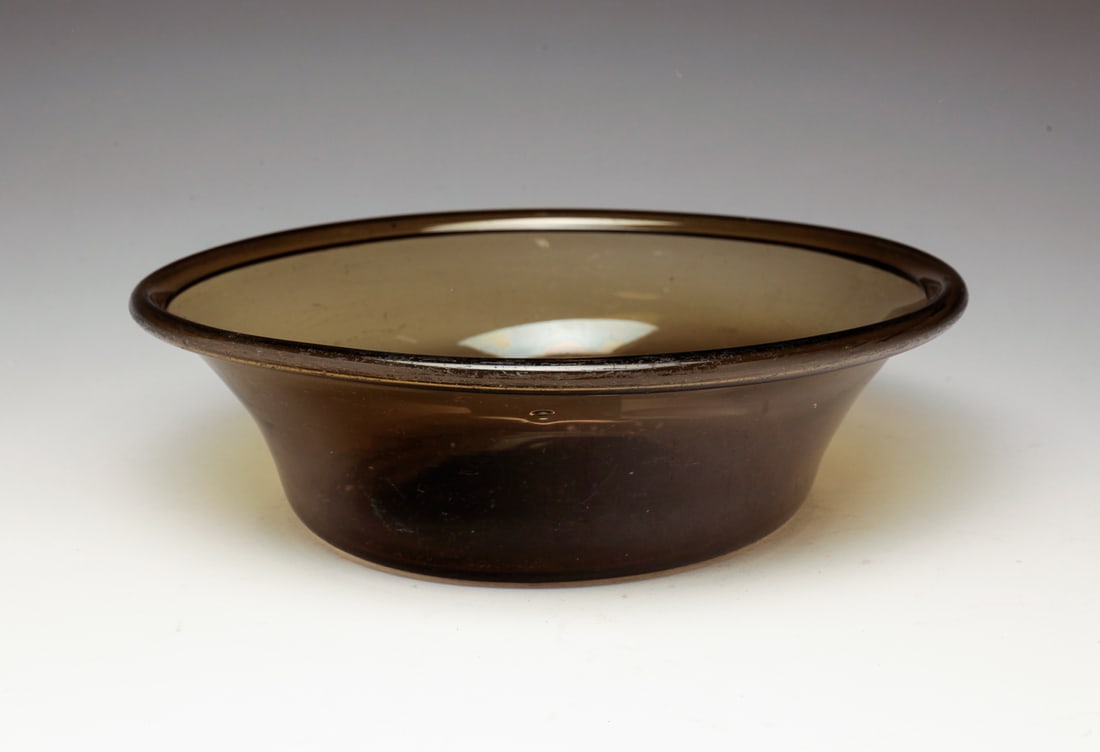AMERICAN BLOWN GLASS OLIVE BOWL.: American, mid 19th Century. Folded rim. Surface wear. 2.75"h. 9.75"d.