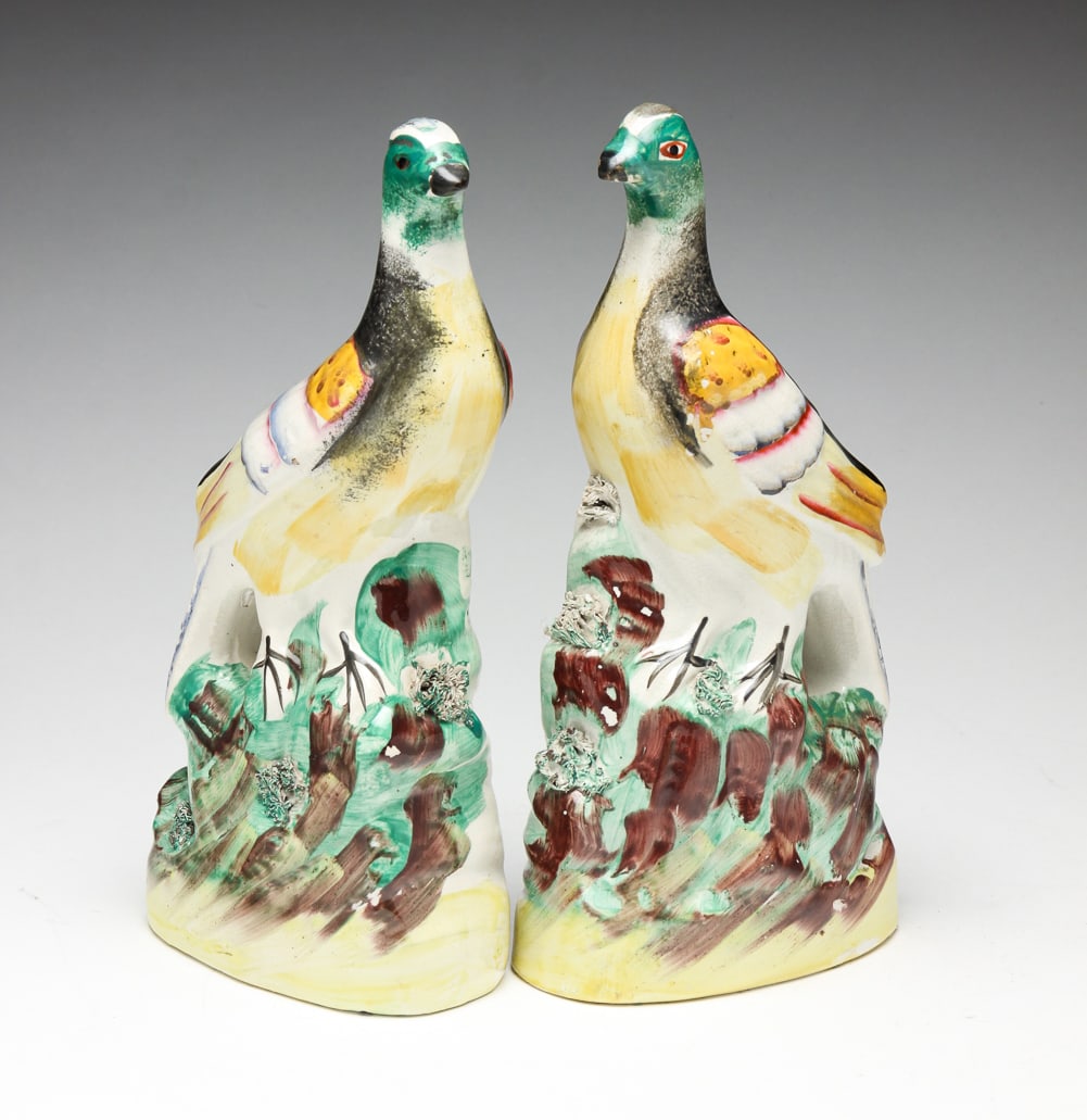 PAIR OF ENGLISH STAFFORDSHIRE GAMEBIRDS.: Endland, mid-19th Century. Possibly pheasants with colorful hand decoration and coleslaw details. Some minor glaze flaking. 10"h.