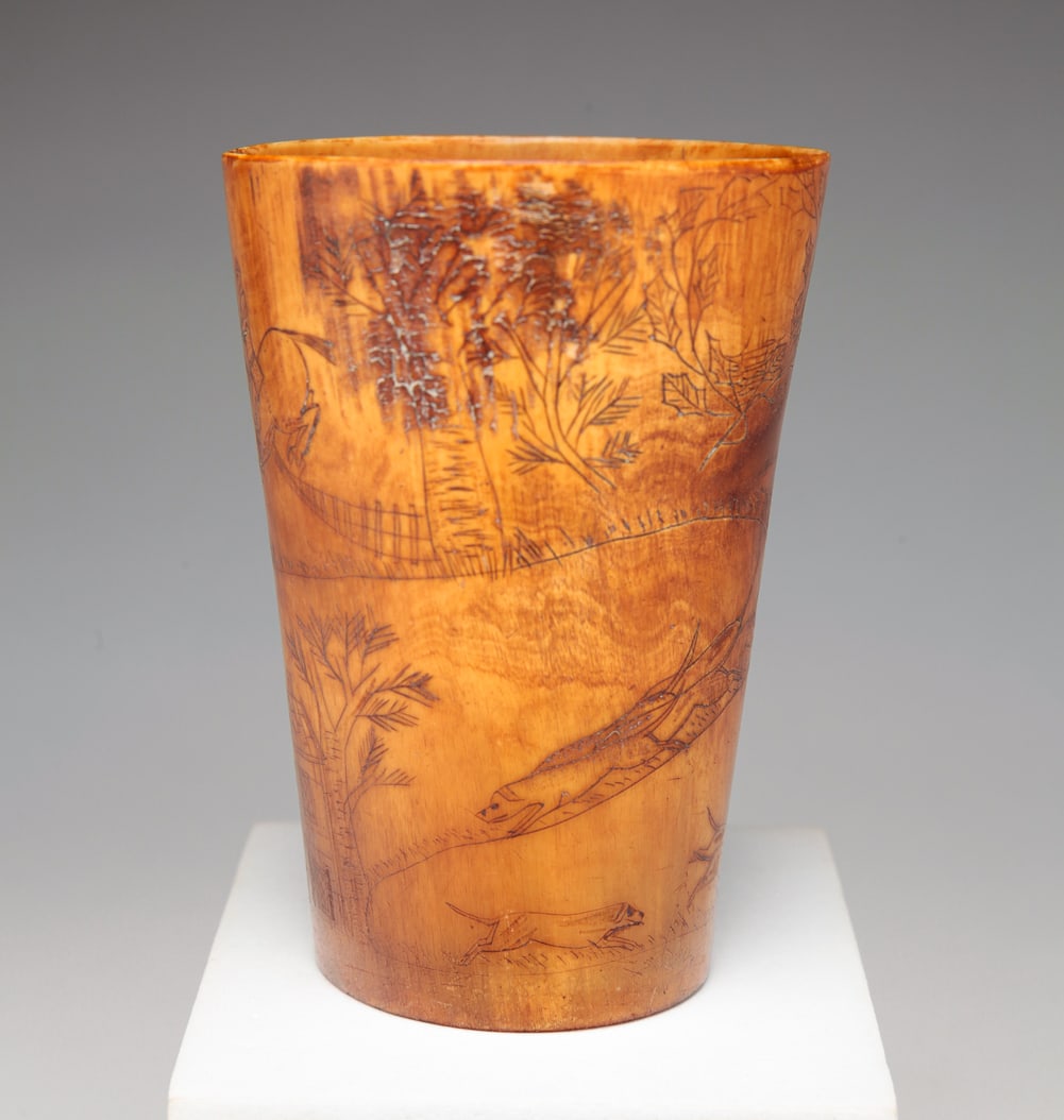 ENGLISH ENGRAVED HUNT SCENE HORN CUP.: Mid 19th Century. Spiraliing scene of hounds, huntsman on horseback and brick houses. 4"h.