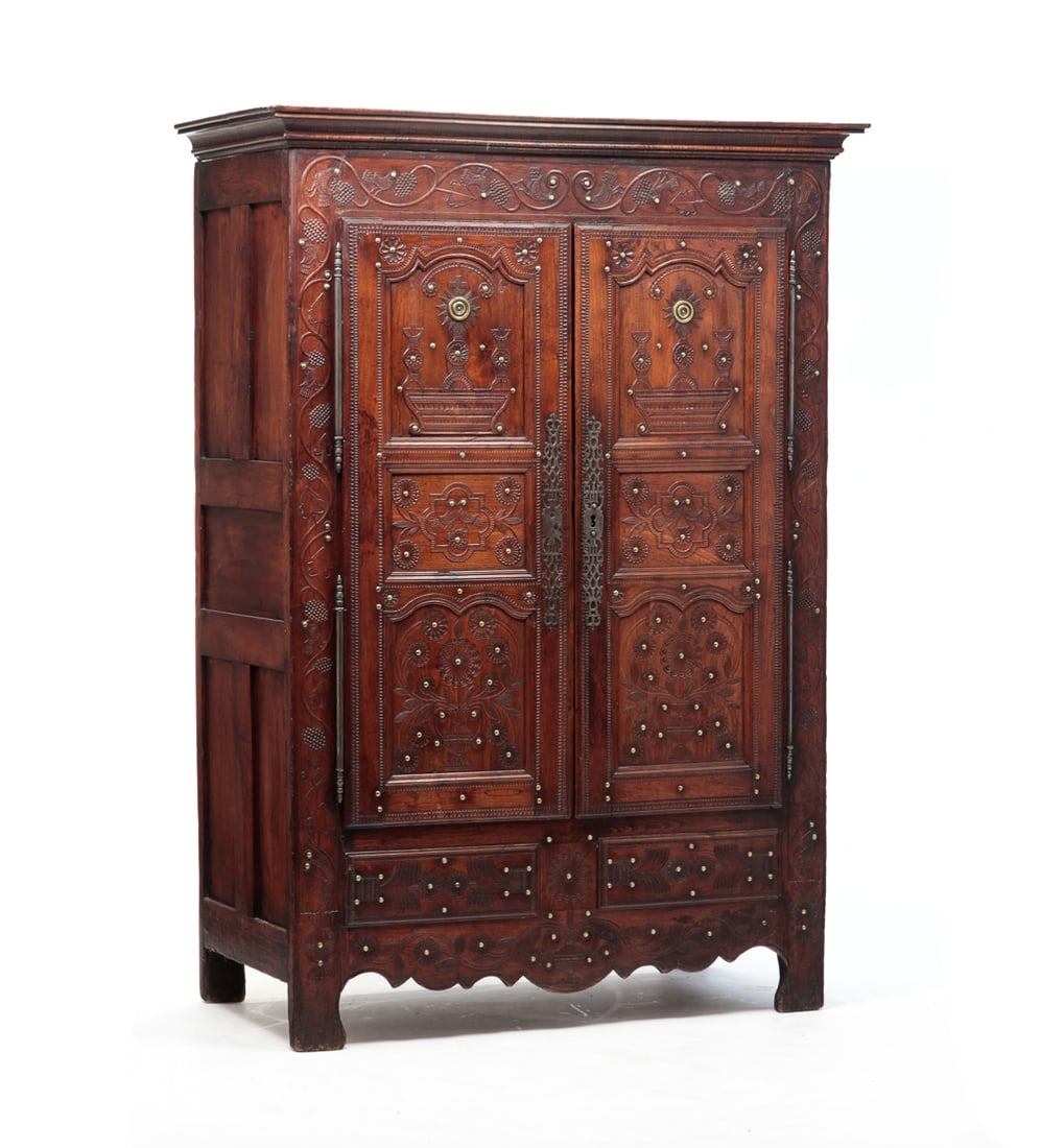 CARVED ECCLESIASTICAL CUPBOARD.: Possibly French, scratch carved date 1839, walnut. Removable molded cornice, fire panel ends and front with carved vining grapes and bird border, three panel doors upper with monstrance like carving. 