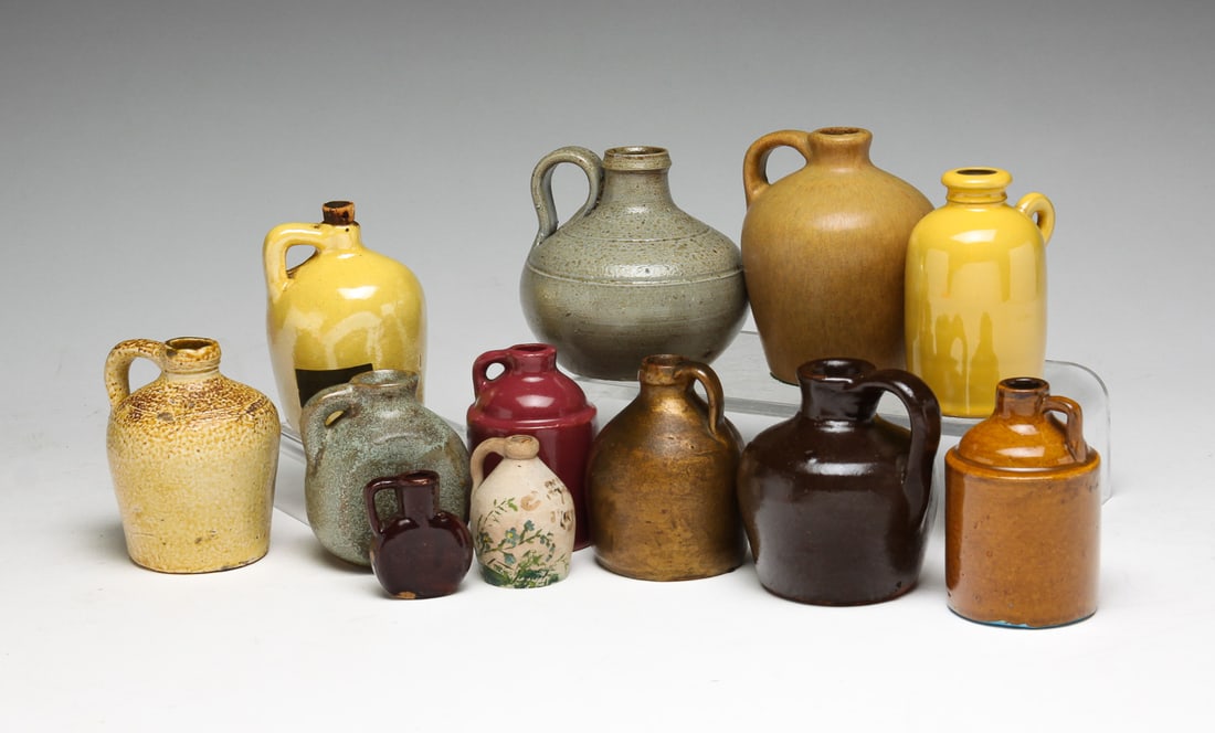 GROUP OF MINIATURE JUGS.: American, 20th Century. One marked "Jugtown", 3.5"h., one marked "Sweden" with yellow glaze, 3.25"h., one with paper label for "San Jose Potteries" with yellow glaze, 3.25"h.