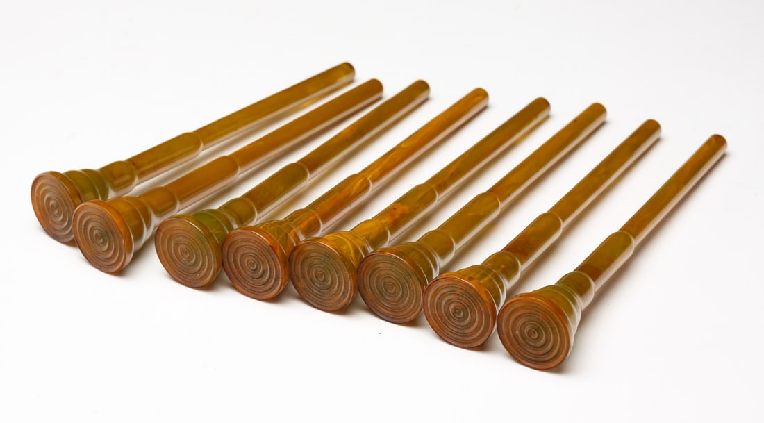 EIGHT BAKELITE COCKTAIL MUDDLERS.: Early 20th Century. Amber colored. 5"h.