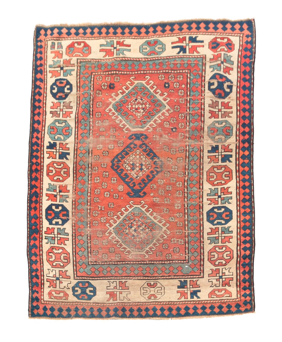 KAZAK RUG.: Late 19th Century. Wide ivory border, red ground. Worn areas, stain. 4'4"w. 5'10"l.