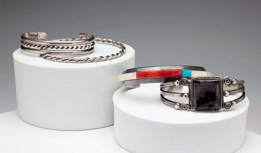 FOUR SILVER BRACELETS. (1 of 4)