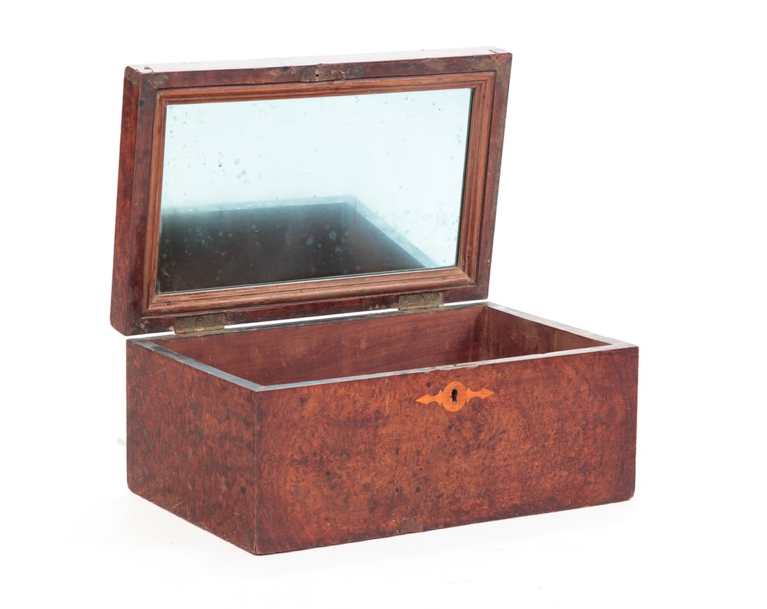 INLAID JEWELRY BOX.: England, late 19th Century. Mahogany. Burled veneer, heart, fan, circular and line inlay. Interior mirror under lid and missing tray. Some veneer damage. 7.5"h. 16"w. 10"d.