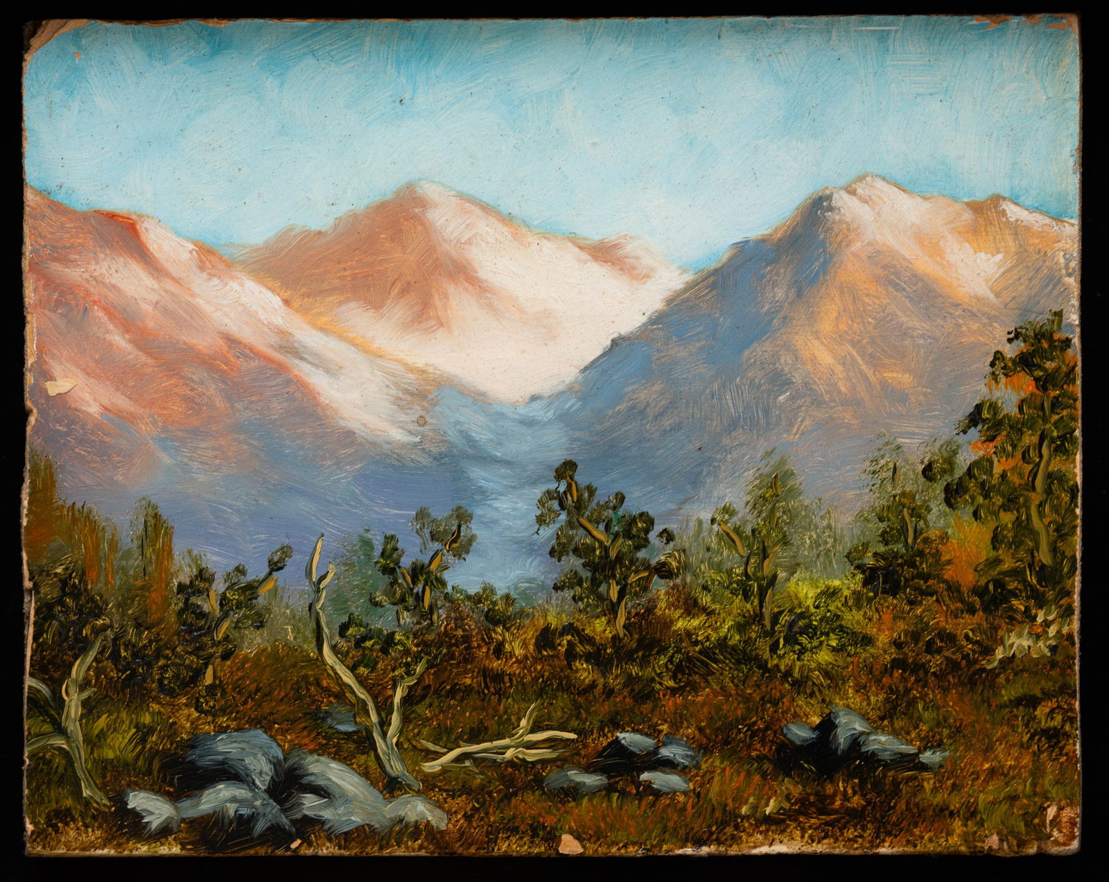 AFTER JOSEPH HENRY SHARP (1859-1953) "MOUNTAIN LANDSCAPE".: American, late 19th Century. Oil on board in a Hackman frame. Unsigned. Bright view of mountains, with trees in the foreground. 5.5"h. 7"w. (sight). Frame, 9.5"h. 11"w.