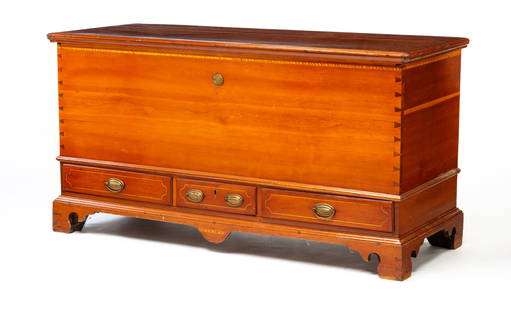 CHIPPENDALE BLANKET CHEST.: American, circa 1800. Cherry with poplar and wormy chestnut secondary. Lid with applied edge moldings, dovetailed case and bracket feet, three overlapping dovetailed drawers and interior lidded till.