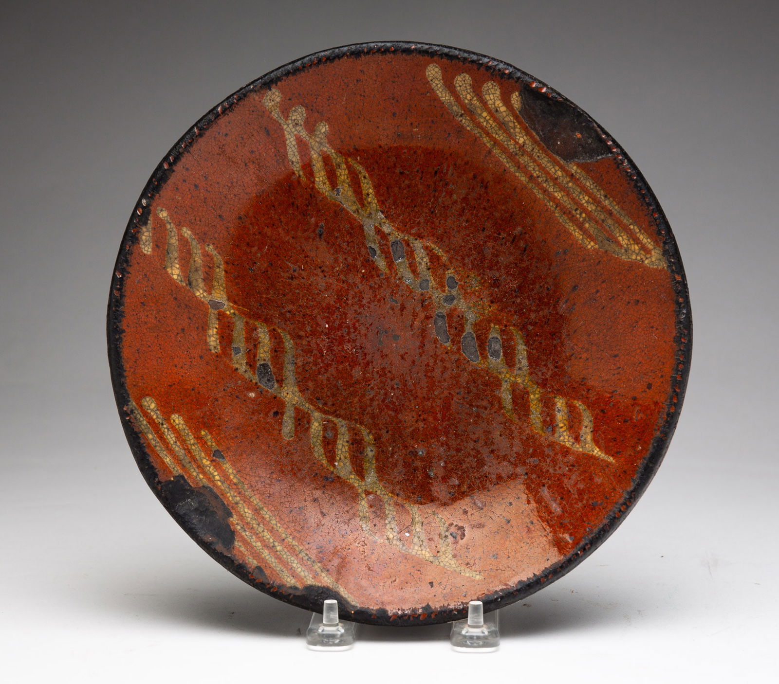 REDWARE PLATE WITH SLIP DECORATION. (1 of 3)