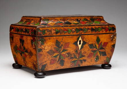 CARVED AND DECORATED JEWELRY BOX.: England, third quarter 19th Century. Pine and sapwood veneer. Sarcophagus shaped with bun feet, geometric carving with polychrome decoration. Silk lineal lid, lift out tray with missing separators. So