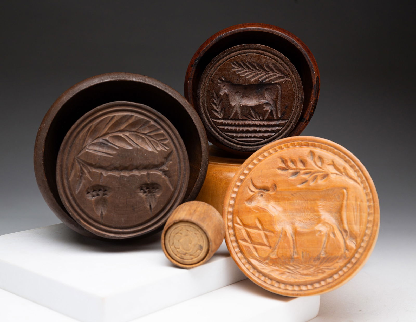 FOUR CASED BUTTER MOLDS. (1 of 4)