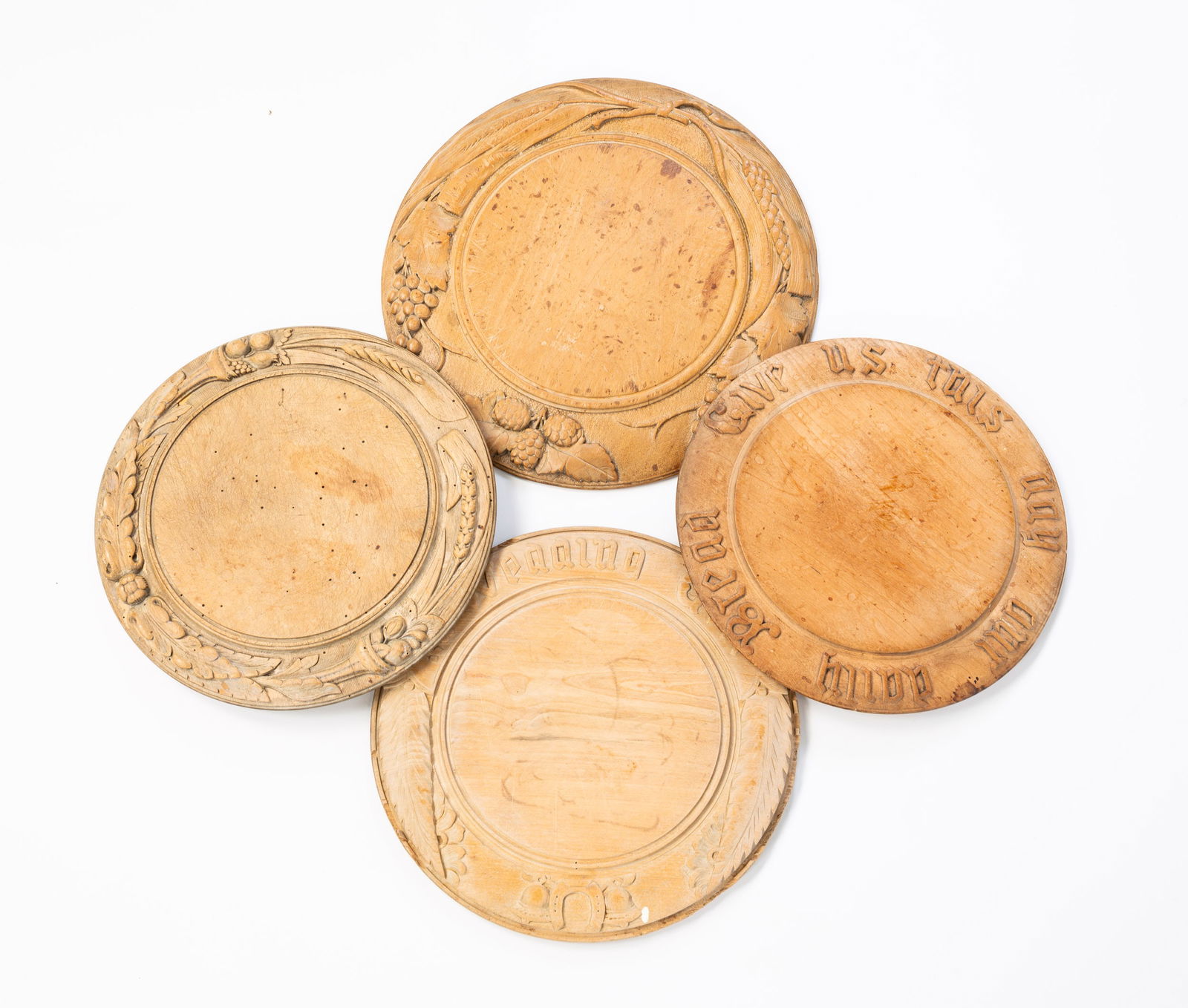 FOUR CARVED BREAD PLATES. (1 of 6)