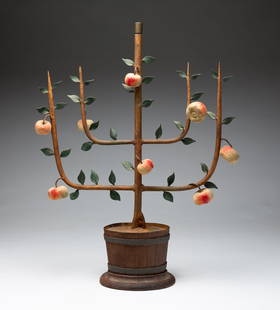 PRIMITIVE METAL LAMP BASE.: American, 20th century. Painted iron with bucket base, four arms with fruit and leaves and center socket for bulb. 19"h. 14.5"w. Part of the Bruce & Vivalyn Knight Collection.