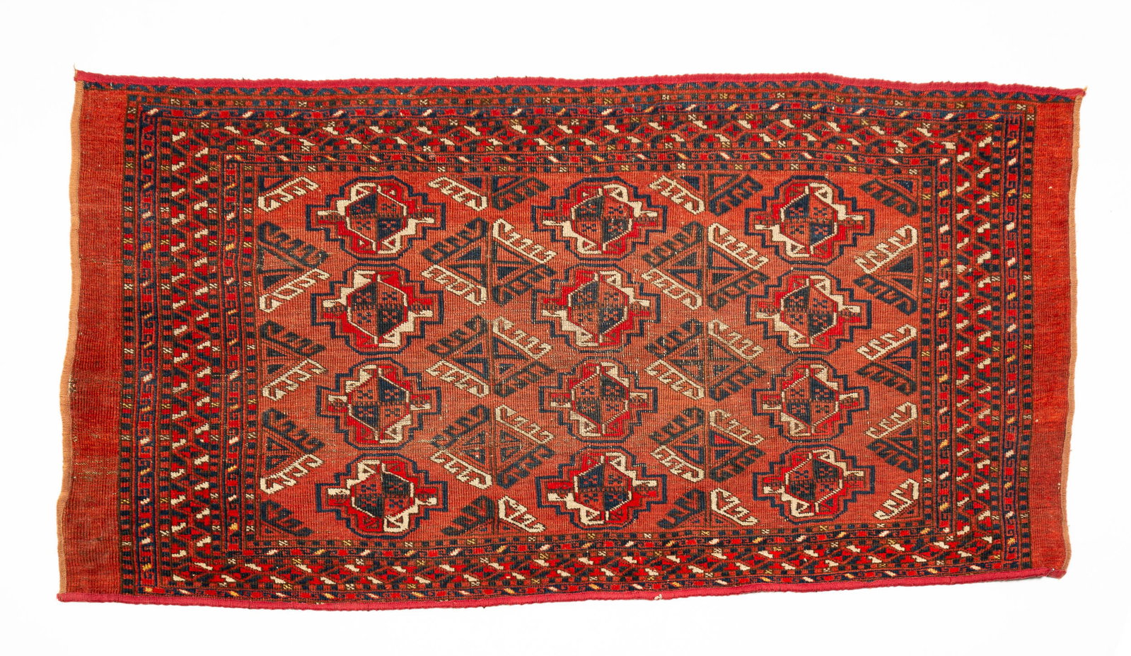 BOKHARA AREA RUG.: Mid 20th Century. Typical pattern in rusts creams and black. Wear and ends have been rebound. 2'6"w. 4'7"l.