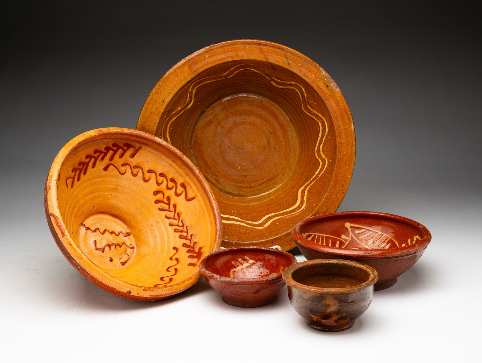 FIVE REDWARE BOWLS. (1 of 6)