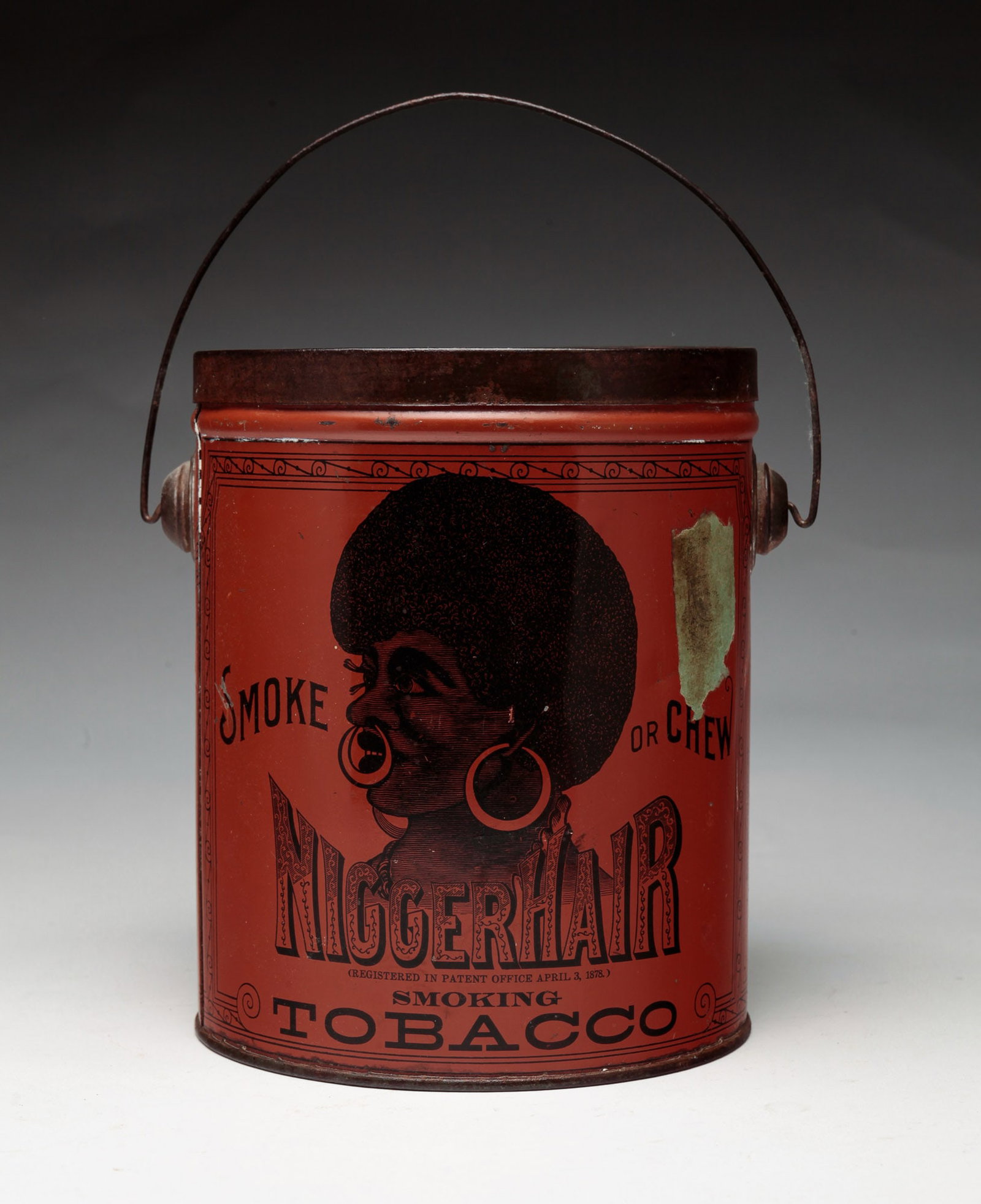 TOBACCO TIN.: American. Patented April 3,1878. Burnt orange background with black lithographs. Remnants of tax seal. A few small dents and scratches. 6.75"h.