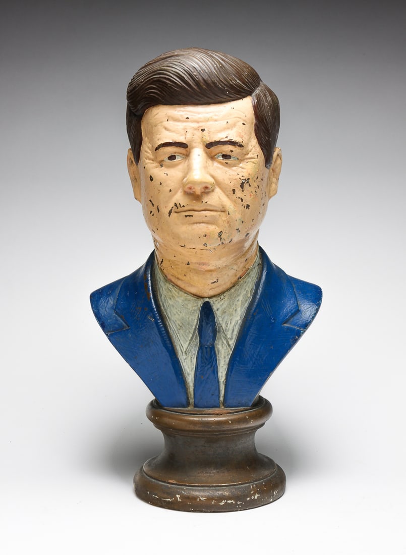 PLASTER BUST OF KENNEDY.: American, 20th Century. Made by "Esco Products, Inc.", ca. 1980s. Polychrome overpaint has flaked. 17"h.