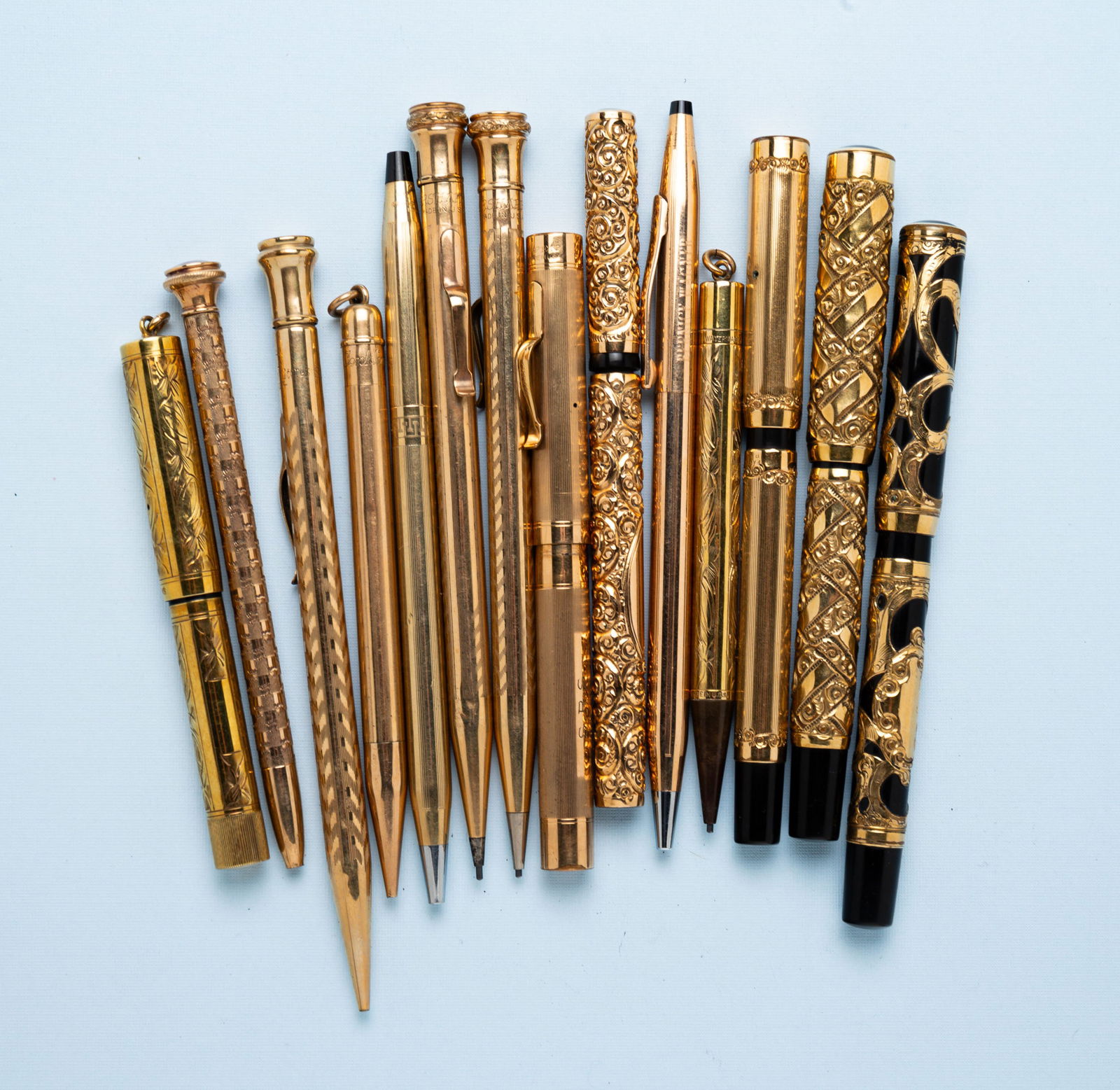 GROUP OF FOURTEEN GOLD TONED OR PLATED VINTAGE WRITING UTENSILS. (1 of 1)