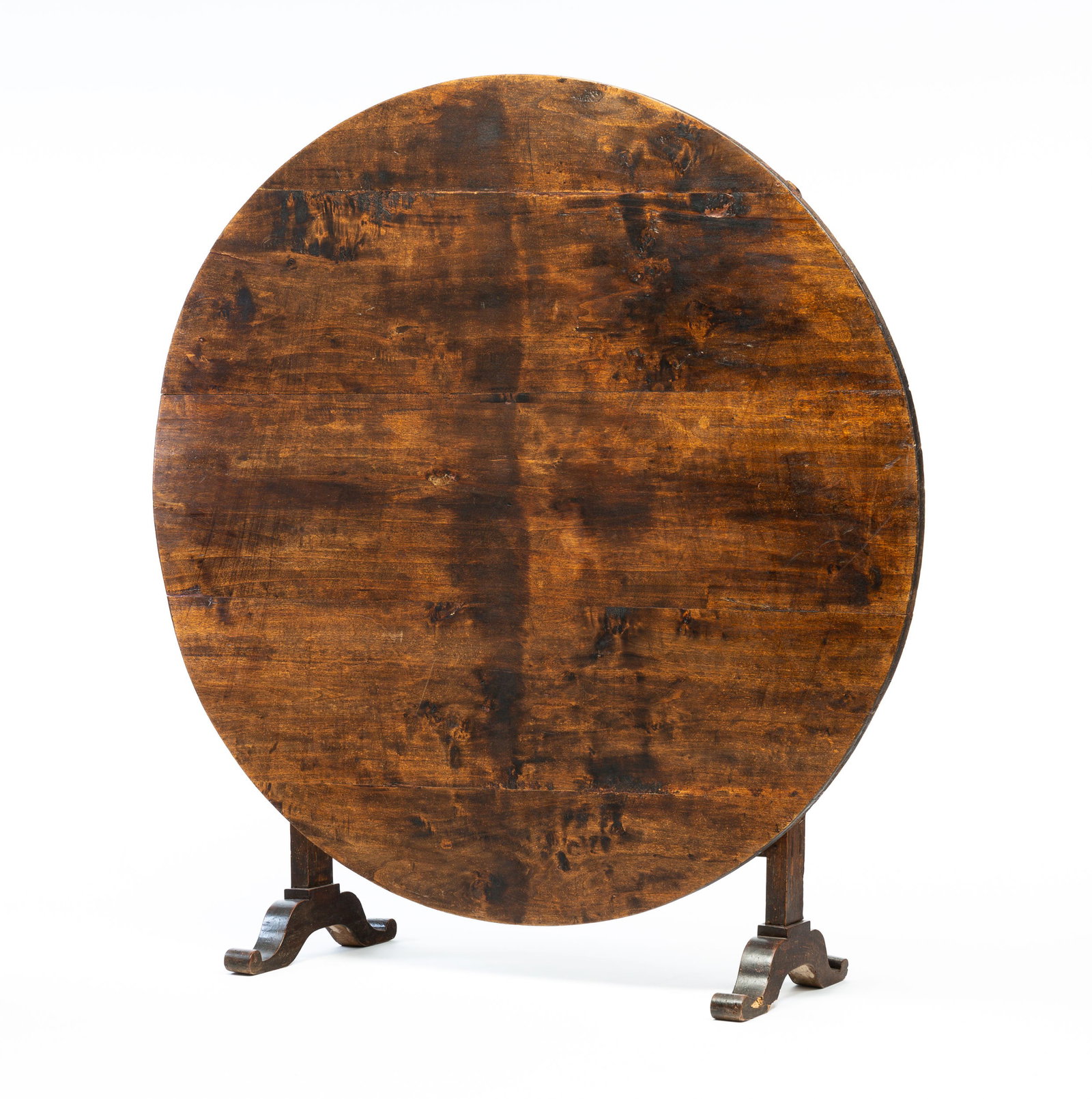 UNUSUAL TILT TOP WINE TASTING TABLE.: French, mid 19th Century. Mixed woods. Round five board top with battens, base with mortised construction, scrolled feet and "V" shaped swiveling support. Refinished, wear and insect damage. 30"h. 49"