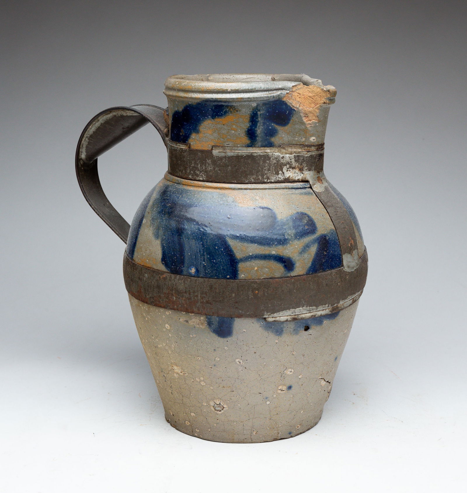 STONEWARE PITCHER WITH MAKE-DO REPAIR. (1 of 6)
