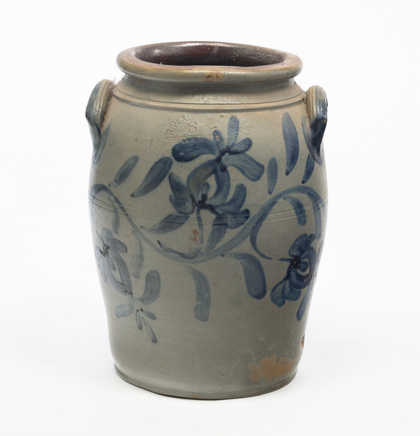 A FREEHAND DECORATED R.W. RUSSELL (BEAVER, PA) SIX-GALLON CROCK.: American (Pennsylvania), 19th Century. Large freehand cobalt vines with flowers, lug handles. Impressed mark at top center. 16"h. From The First Installment of The Beth & Earl Trimble Salt Glazed Ston