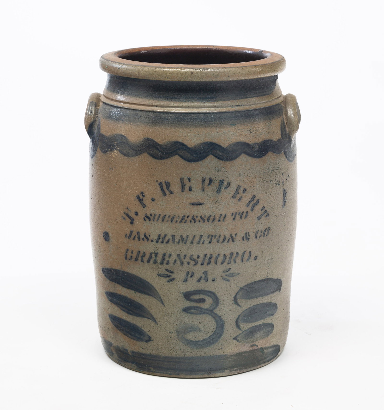 DECORATED THREE-GALLON STONEWARE JAR BY T.F. REPPERT (GREENSBORO, PA), SUCCESSOR TO JAS. HAMILTON &: American (Southwestern Pennsylvania), 19th Century. Strong cobalt stenciled label with stylized "3", bold lines, and squiggles. Lug handles with oversized cobalt lollipop accents. 13.25"h. From The Fi