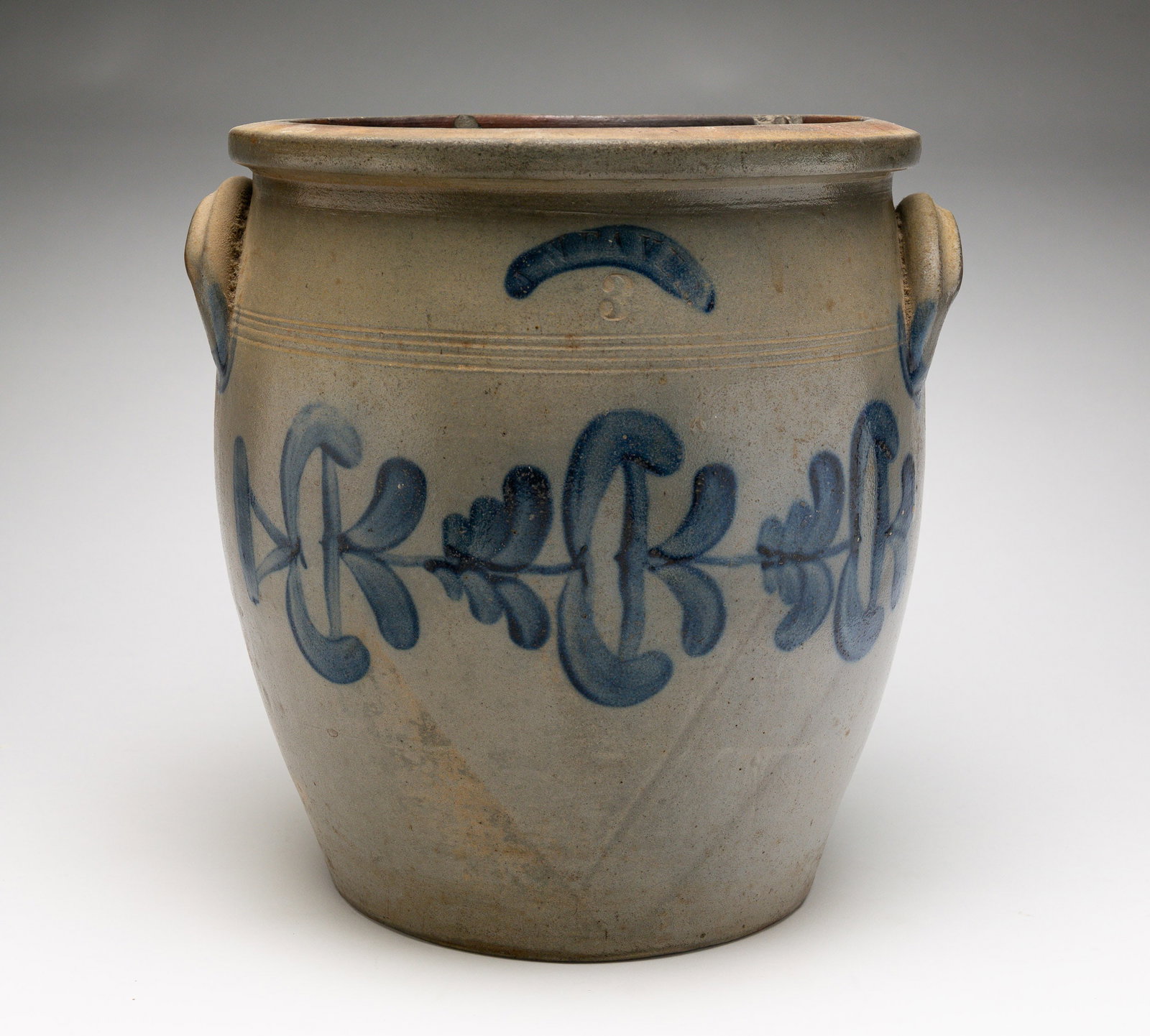 J. WEAVER (BEAVER, PA) FREEHAND DECORATED THREE-GALLON STONEWARE JAR.: American (Pennsylvania), 19th Century. Strong cobalt horizontal vine with flowers across middle, impressed mark at top center, lug handles. 12"h. From The First Installment of The Beth & Earl Trimble 