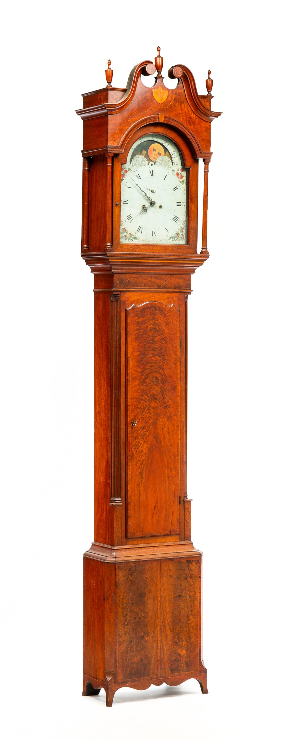 PENNSYLVANIA HEPPLEWHITE TALL CASE CLOCK.: Fayette County, circa 1800. Walnut with poplar secondary. Bonnet with urn turned finials, broken arch pediment, inlaid shield with incised carved eagle, vine inlay, arched door and turned pilasters, c