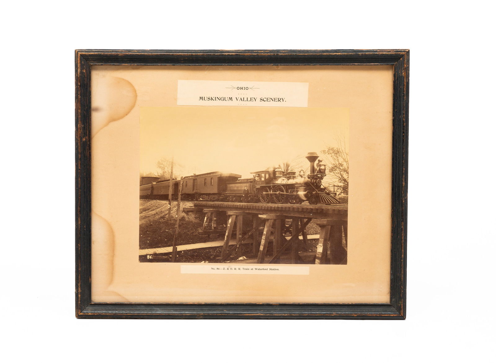 OHIO MUSKINGUM VALLEY SCENERY IMAGE.: Second Half 19th Century, Albumen Print. In a series "No. 86 - Z & O.R.R. Train At Waterford Station. Number 3". Zanesville and Ohio River Railroad locomotive, baggage car and passenger cars at Waterf