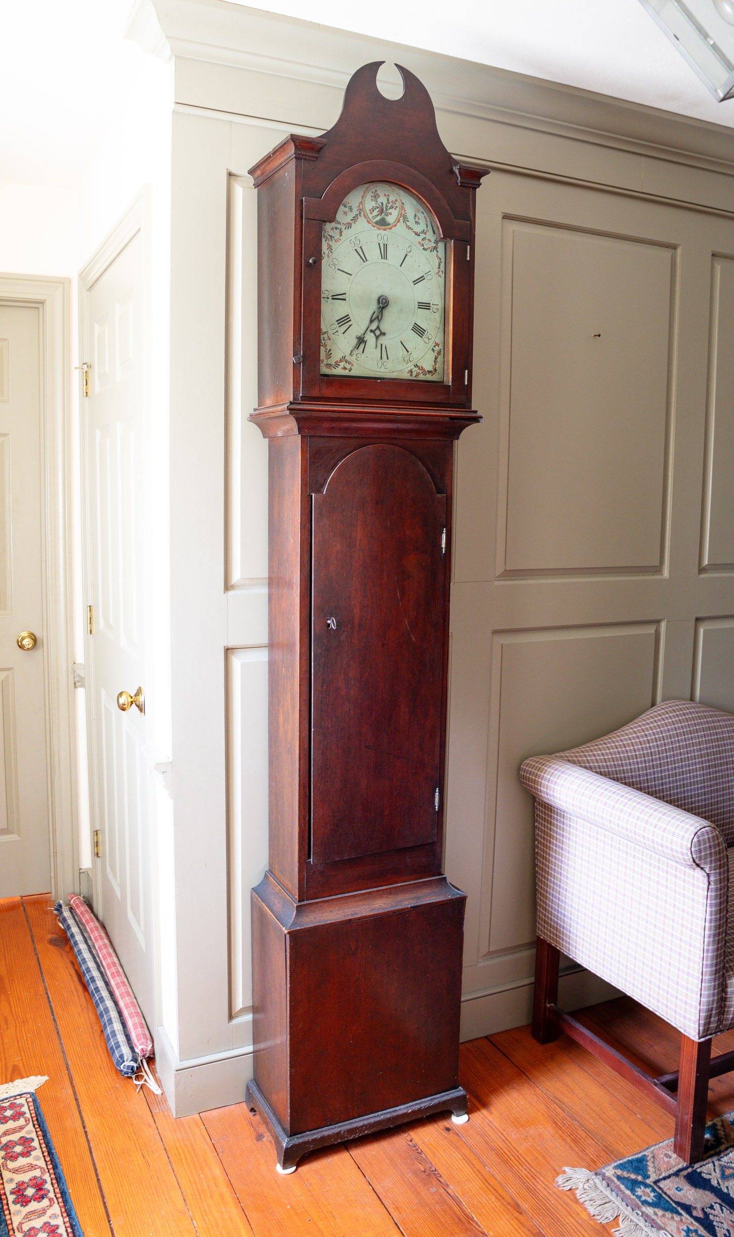 OHIO CHERRY TALL CASE CLOCK.: American (Sandusky, Ohio), circa 1815. Cherry with original surface. Beautiful carved pediment is thick and chamfered. Exceptional clock face with vine scrolled border and scalloped decorated circle w