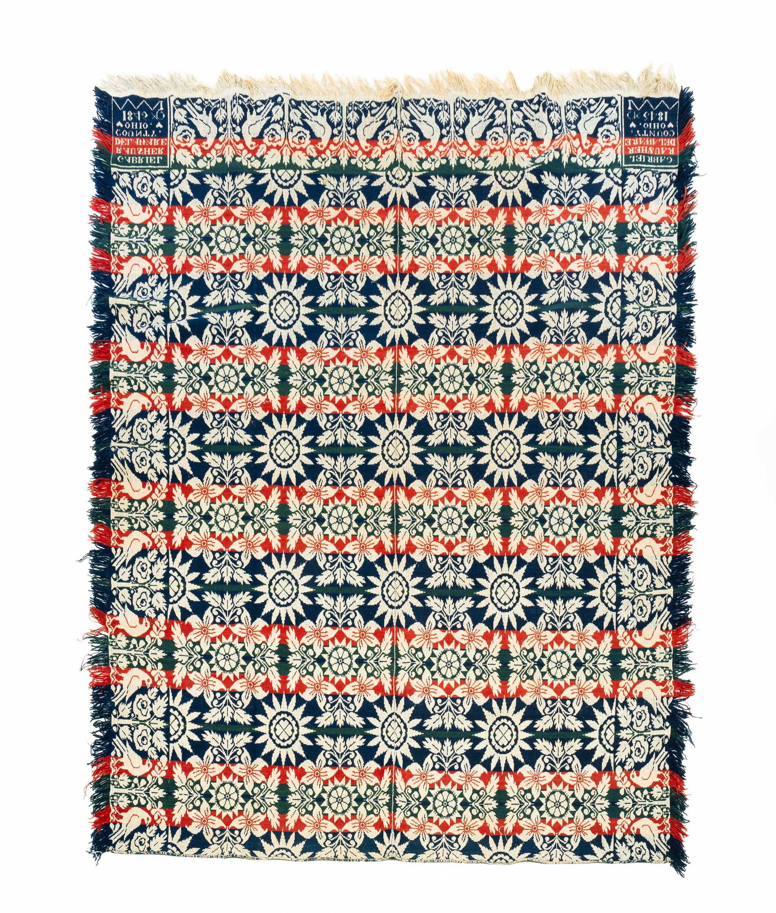 OHIO DOUBLE WEAVE COVERLET BY GABRIEL RAUSCHER: American (Delaware County, Ohio), dated 1843. Wool in red, dark green, and blue (indigo). Birds and flower border with center field in flowers and medallions. Corner block signed, "Gabriel Rauscher De