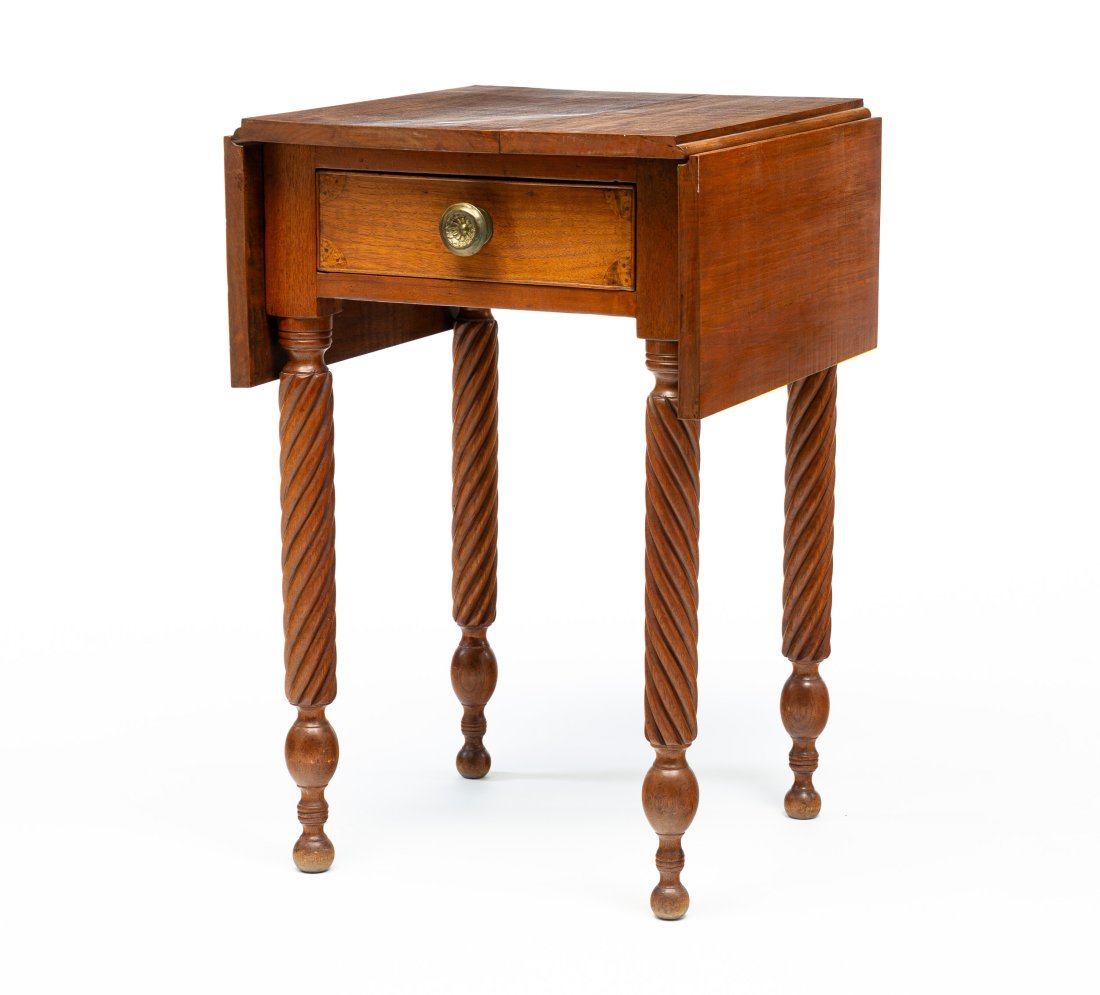 SHERATON DROP LEAF STAND.: American (Ohio), second quarter 19th Century. Walnut with poplar secondary. One dovetailed drawer with applied beaded edge and burled fan inlay and rope turned legs. Refinished. 29.75"h. 37.5"w. with 