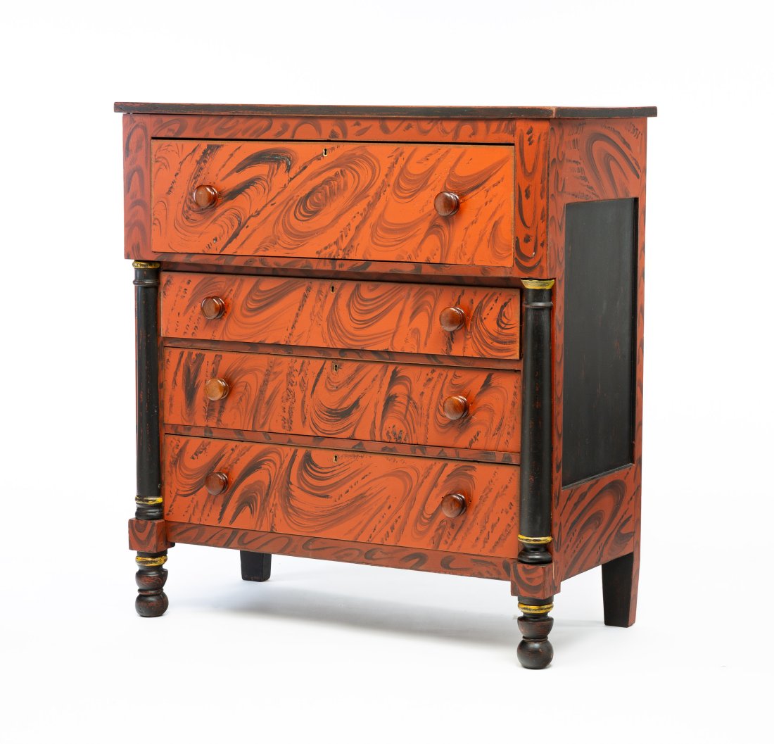 GRAIN PAINTED TRANSITIONAL CHEST OF DRAWERS.: American, second-quarter 19th Century. Walnut with pine and poplar secondary. Sheraton to empire, paneled ends, half turned pilasters, turned feet and four dovetailed drawer. Contemporary red and blac