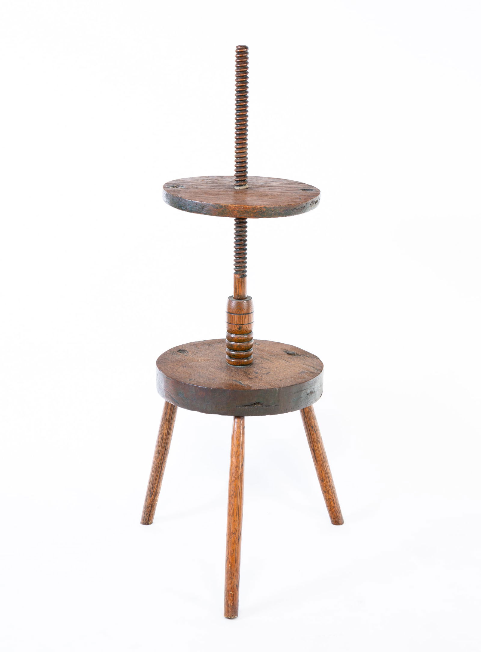EARLY ADJUSTABLE OAK DOUBLE CANDLE STAND.: American (probably New England), 18th Century. Oak and hickory with a threaded and turned standard, dished circular table with double candle sockets, on a simple turned pedestal and tripod-base. Overa