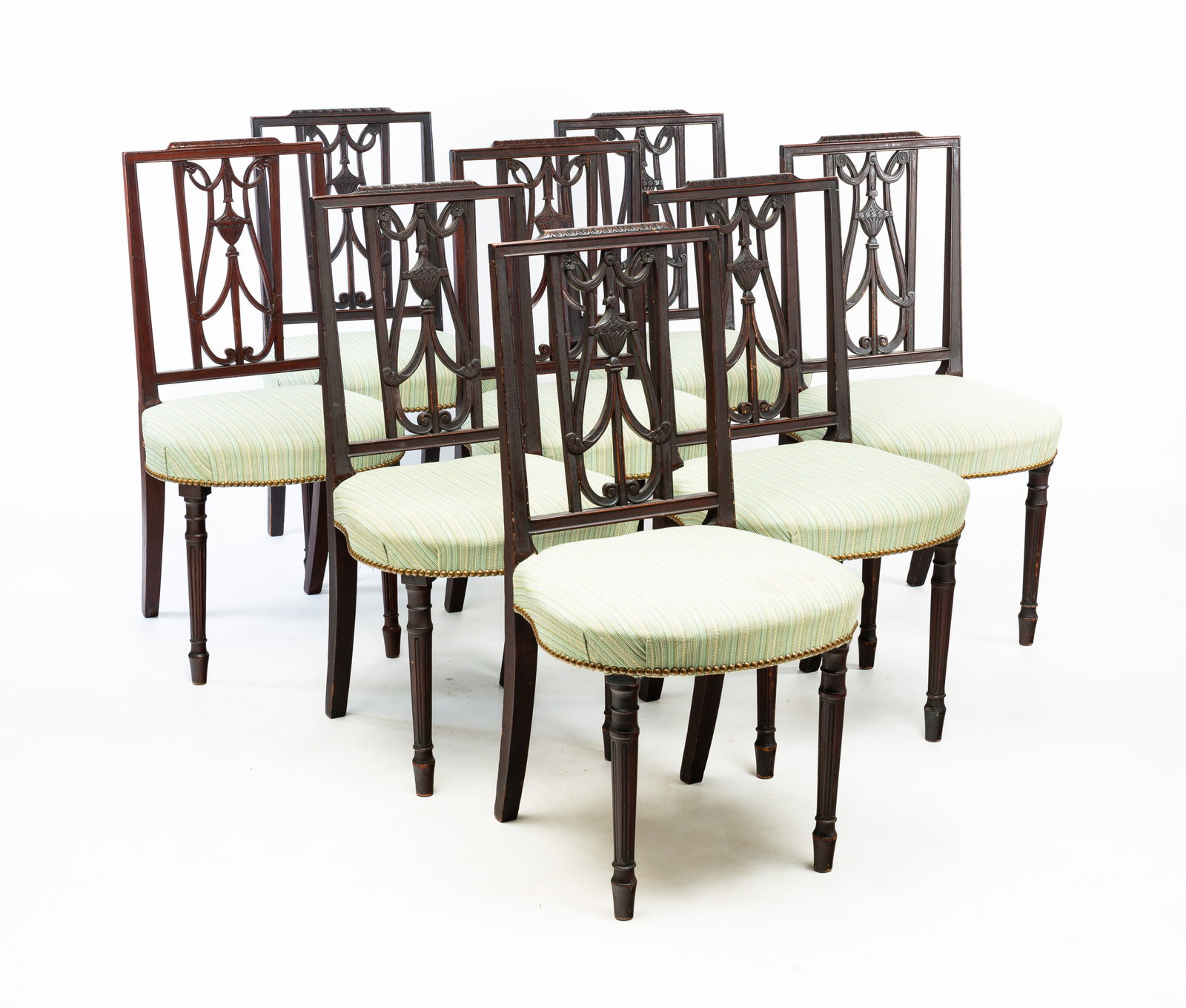 SET OF EIGHT SHERATON SIDE CHAIRS.: American, second quarter 19th Century. Mahogany. Square backs, carved openwork urn and ribbon splats, balloon shaped upholstered seats and turned and stopped fluted legs. Old worn alligatored finish. 