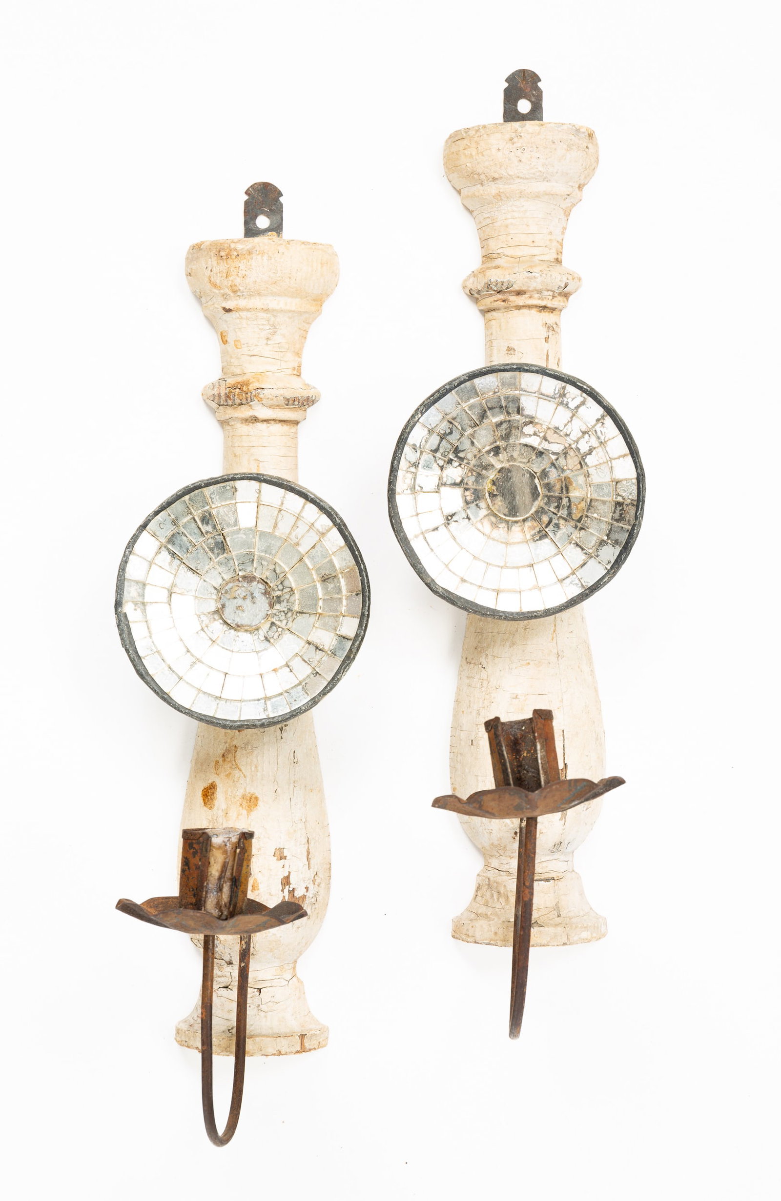 PAIR OF CANDLE SCONCES WITH MIRROR REFLECTORS.: American, 19th Century. White painted wood post with mounted mirrored reflectors and tin arms. 12.25"h. Mirror, 3.75"dia. From the collection of the late Audrey Caspari (New Jersey).