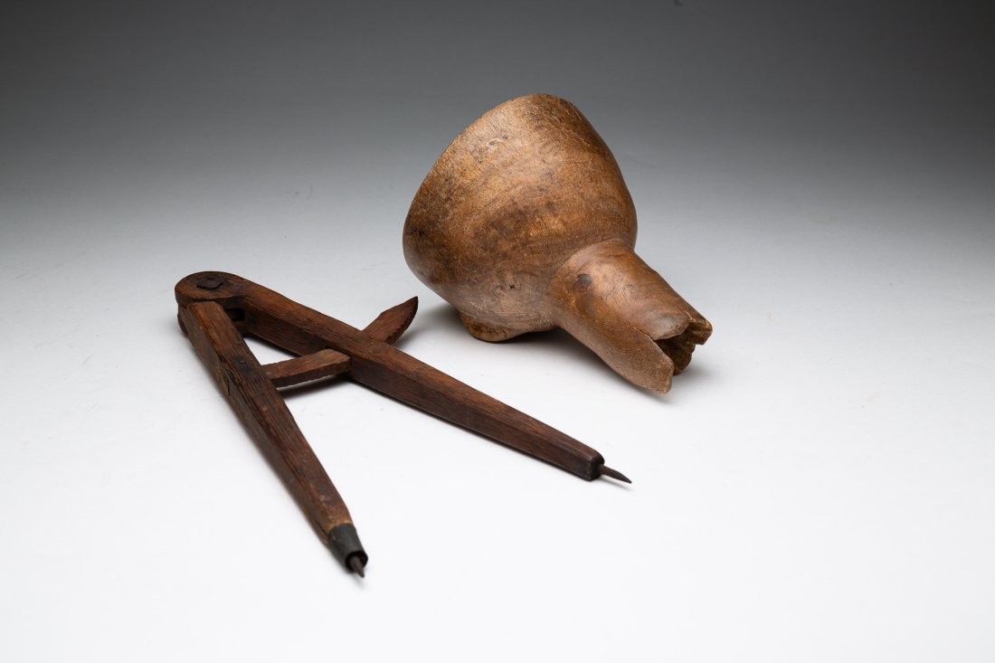 TWO FOLKSY WOODEN PIECES.: American, second half 19th Century. An oak compass with forged iron hard wave. 12.5"h. and funnel. Wear, loss and age splits. 7"h.