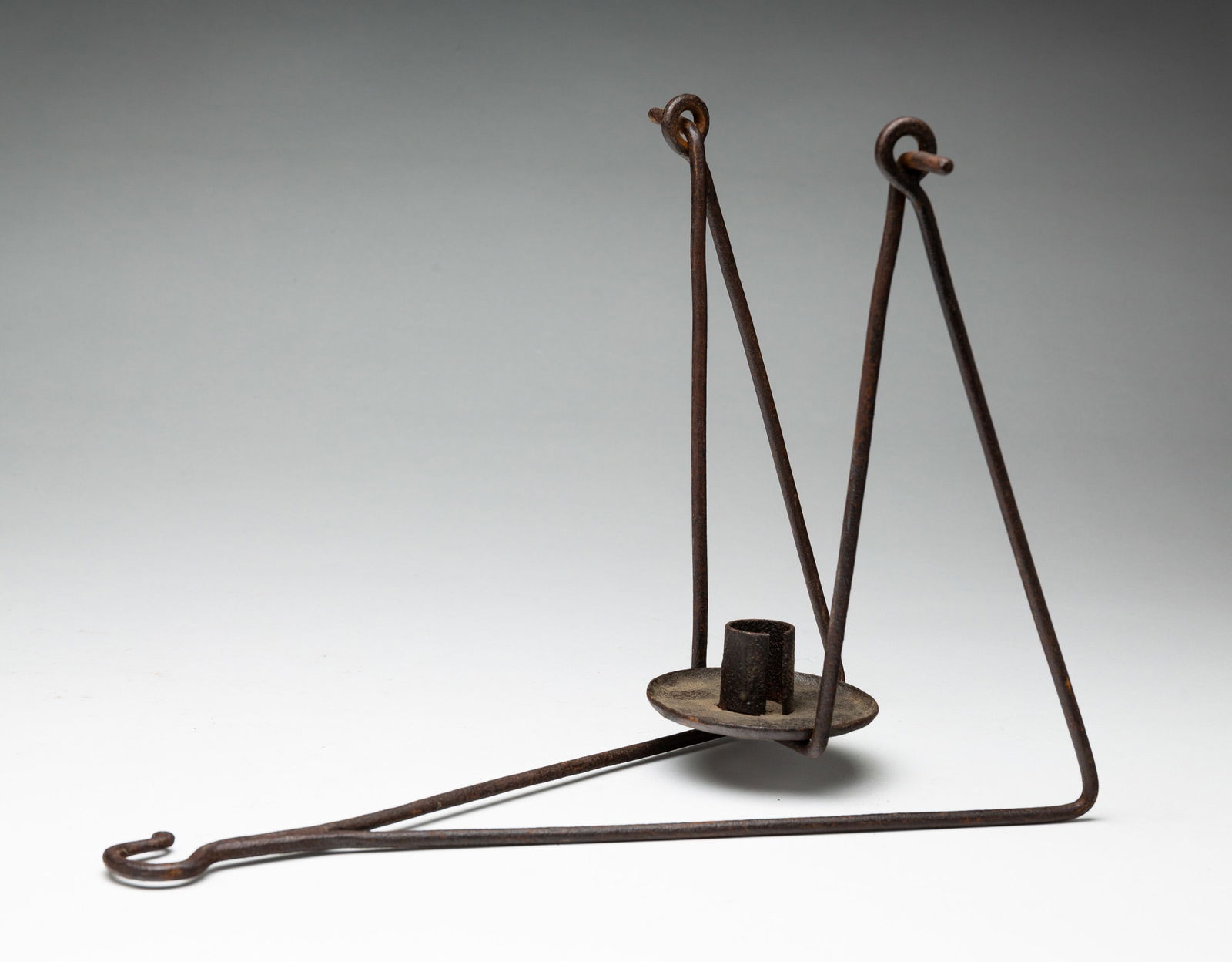 WROUGHT IRON HANGING GIMBLE LAMP.: American, early 19th Century. Single socket and drip pan. 6.5"w., 16"h. From the collection of the late Audrey Caspari (New Jersey).