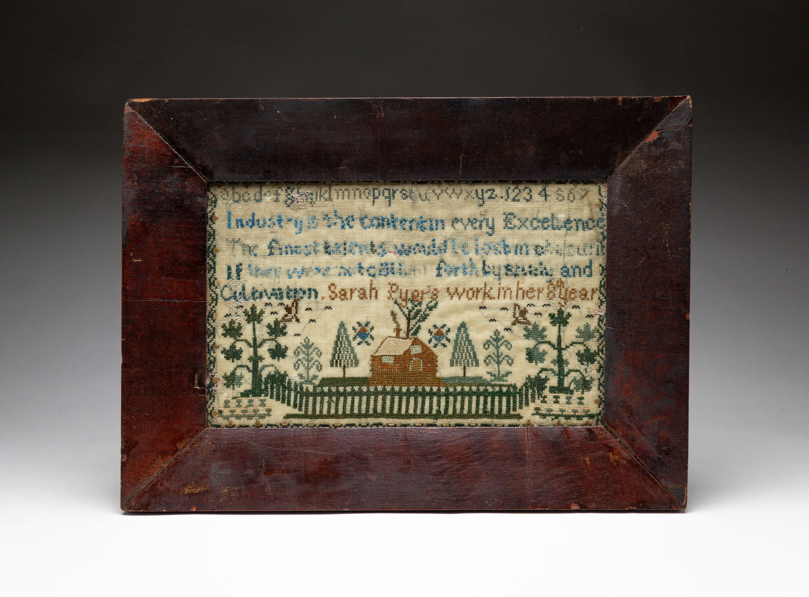 HOLMES COUNTY, OHIO SAMPLER BY SARAH PYER.: American (Ohio), second-quarter 19th Century. Linen. Strawberry border, alphabet, numbers and verse. Done in her 8th year. At bottom house with fenced yard, trees and birds. Wear, loss, holes and stit