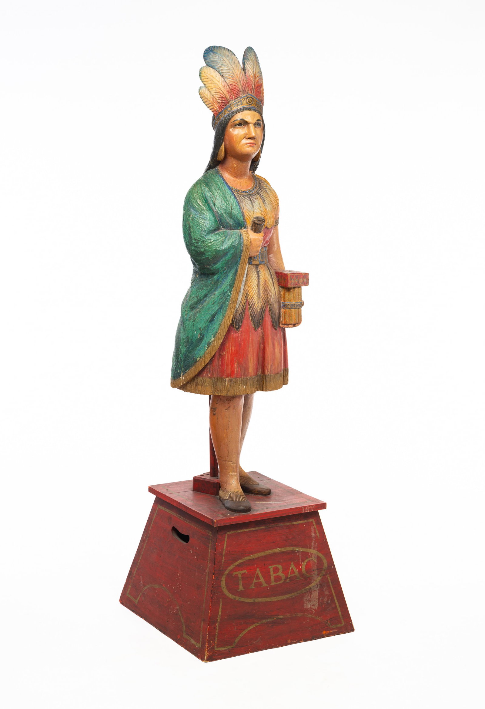 AMERICAN CIGAR STORE INDIAN MAIDEN ATTRIBUTED TO SAMUEL ROBB (1851-1928).: American (New York), late-19th Century. Hardwood carved and polychrome painted figure of a maiden holding cigars. Deep, definitive carved headdress, hair, facial features, feathers, and overall attire
