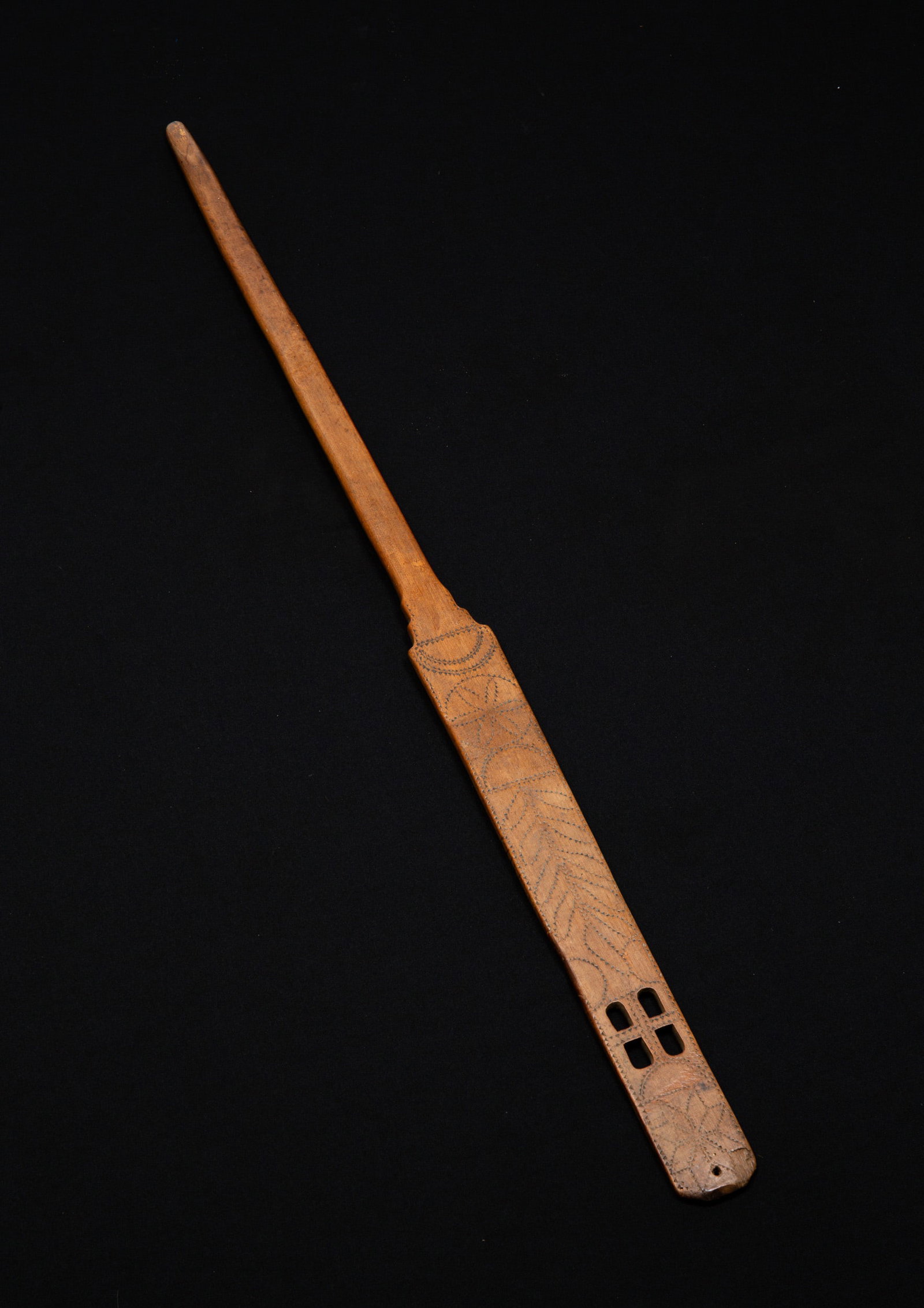 FINELY CARVED WOOD DISTAFF (SWIFT).: European (Scandinavian), late 18th-early 19th Century. Pierce-carved with hex sign, a vertical branch with leaves, and an eight-pointed star. Overall, 35"l. From the collection of the late Audrey Casp