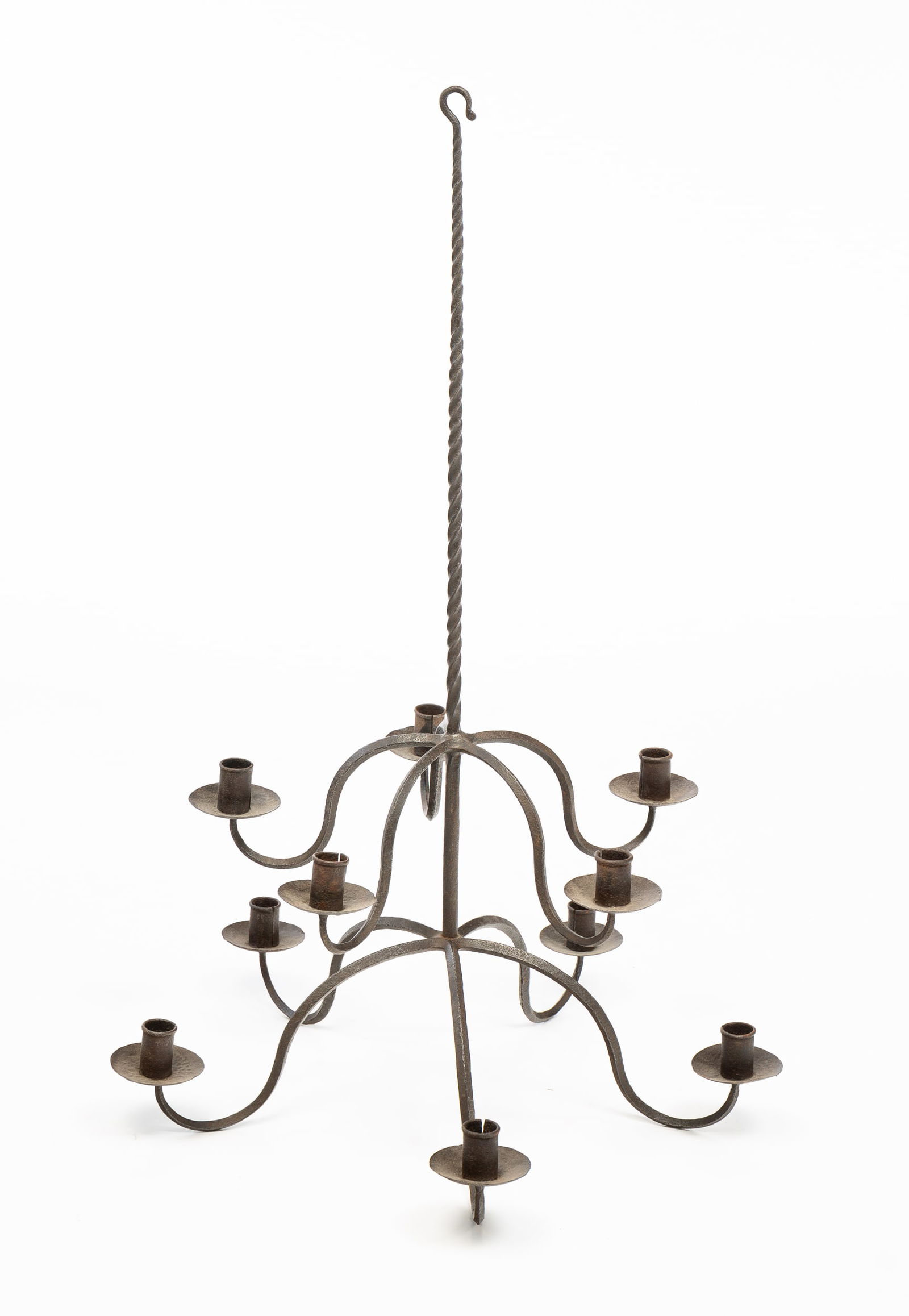 WROUGHT IRON CANDLE CHANDELIER.: European, late 18th Century. Twisted center column with hook finial, two tiers, ten "S" shaped arms chandelier. Overall, 37"h., 23.5" across. From the collection of the late Audrey Caspari (New Jersey