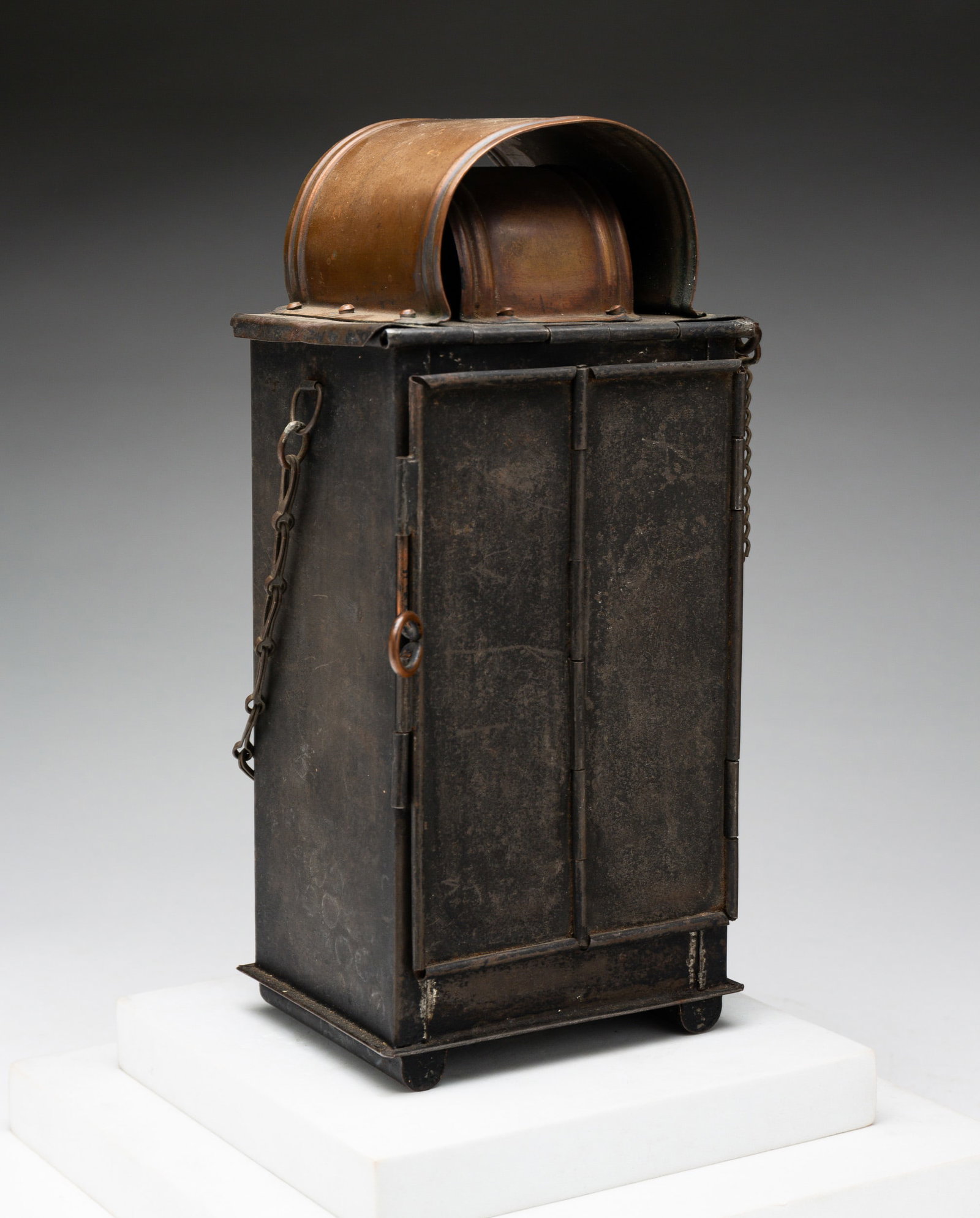 TIN AND COPPER LANTERN.: England, 19th Century. Tin and copper. Tin and copper lantern with bifold door. 4"l 3"w 9.5"h. From the collection of the late Audrey Caspari (New Jersey).