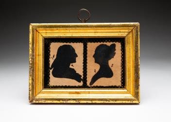 FRAMED HOLLOW CUT DOUBLE SILHOUETTES.: American, second quarter 19th century. George and Martha Washington hollow cut silhouettes with Peale Museum embossed stamps. Eglomise glass and gold leaf frame. Some wear to gold leafing. 5.75"h. 7.7