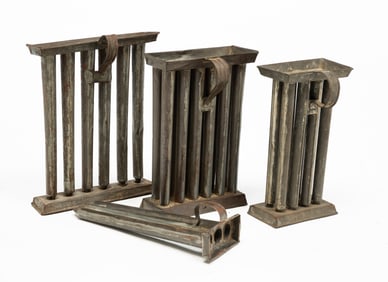 FOUR TIN CANDLE MOLDS.