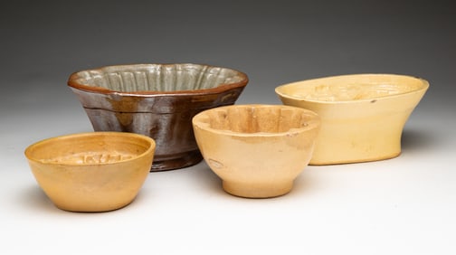 FOUR CERAMIC FOOD MOLDS.