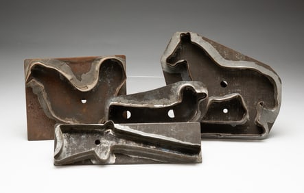 FOUR TIN COOKIE CUTTERS.