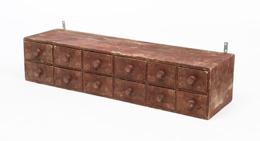 PAINT-DECORATED TWELVE DRAWER PINE CASE.