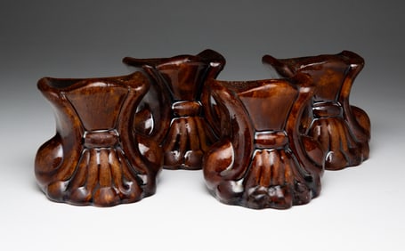 FOUR ROCKINGHAM STOVE FEET.