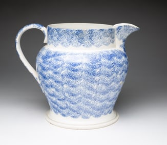 LARGE SPATTER WARE PITCHER.